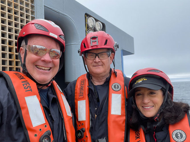 Expedition team working beside a submersible